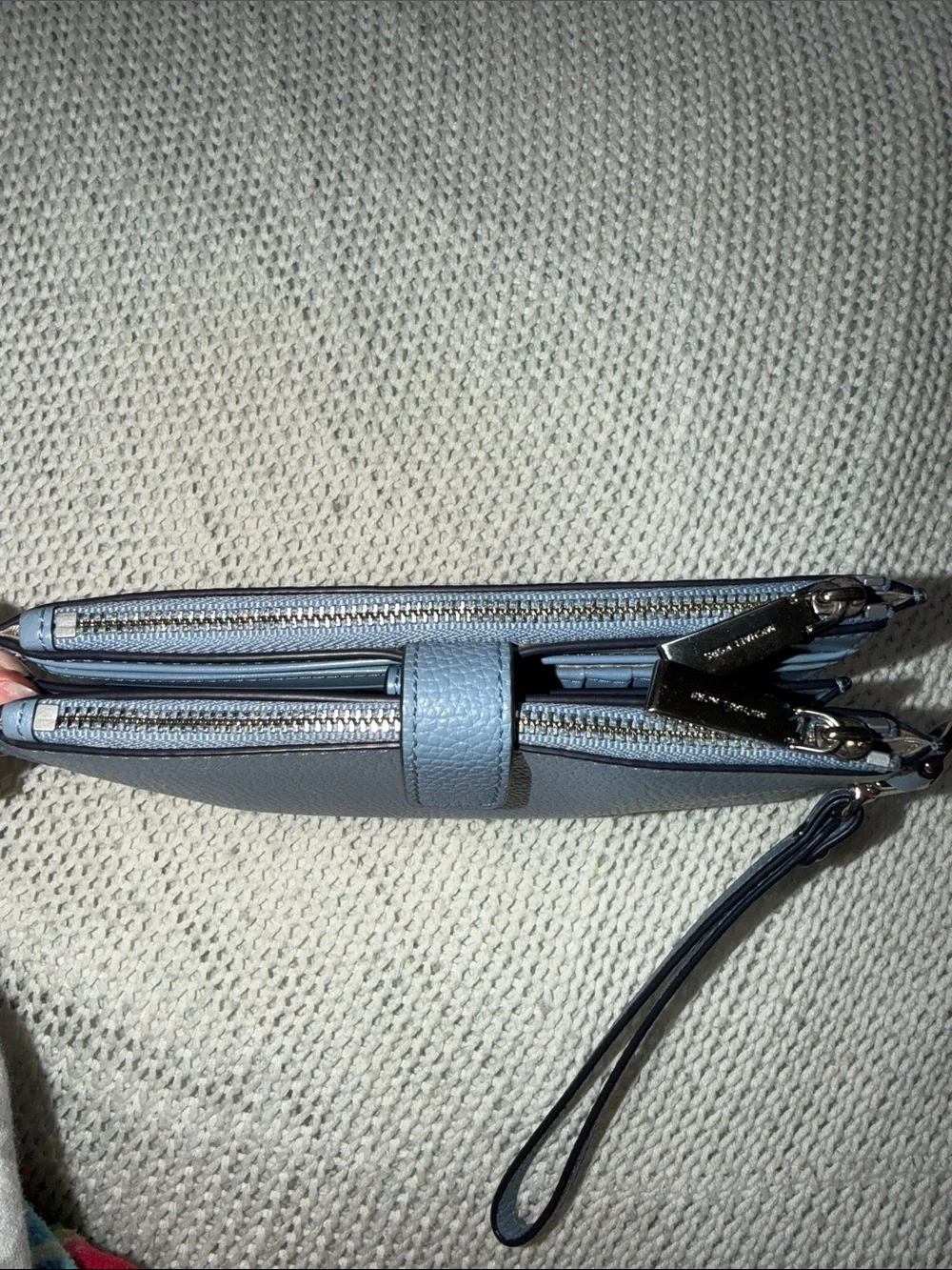 Michael Kors Blue Pebbled Leather Wristlet with silver Logo